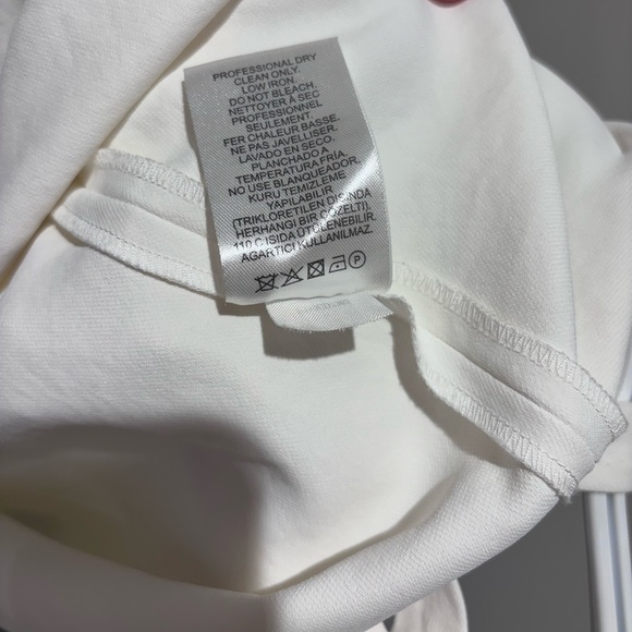 Like new - Elegant Tibi blouse size US0 in a soft warm white colour. - Picture 4 of 4